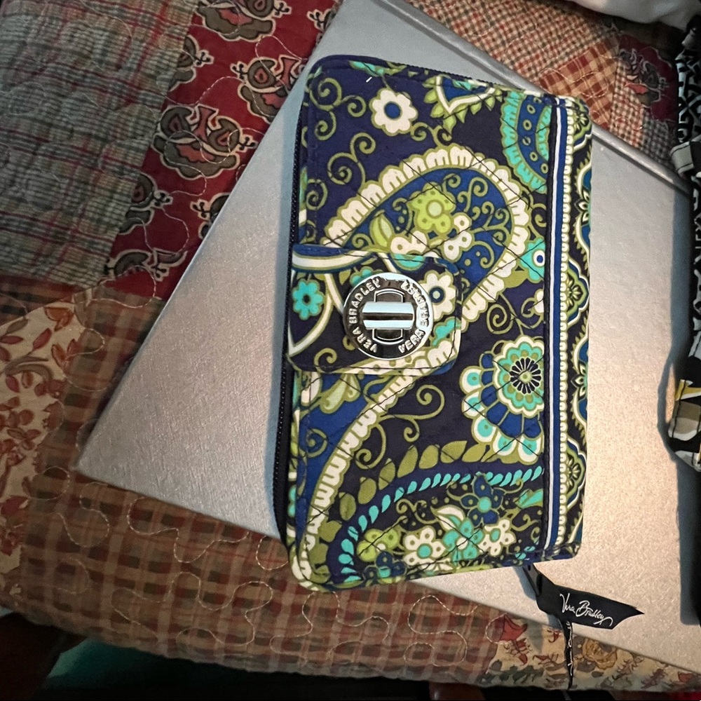 Vera Bradley wallet and cosmetic bag both are new and sold together or separate
